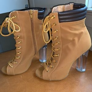 Lace up open-toed booties with clear block heels